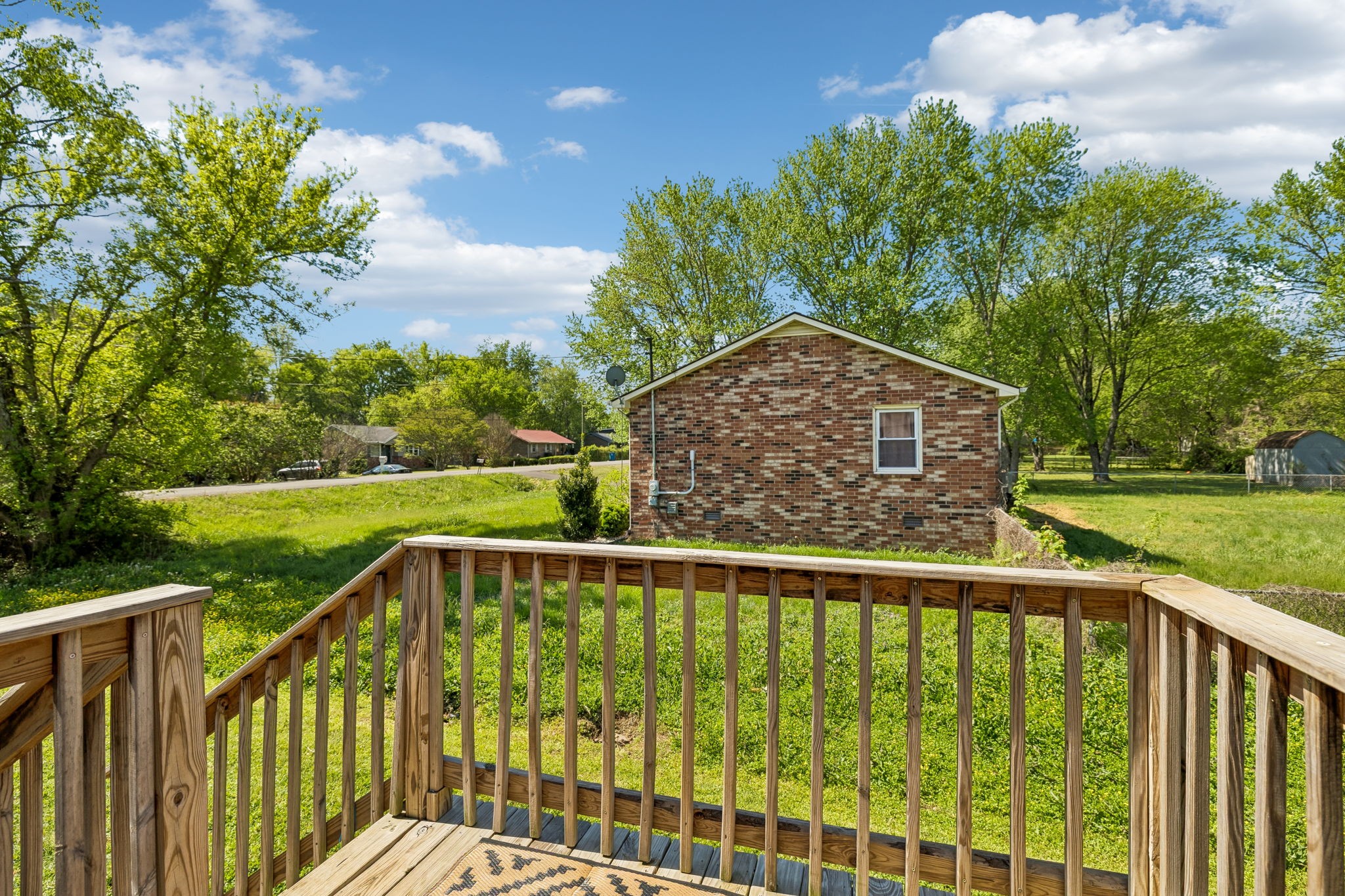 8617 Maple Street Murfreesboro, TN 37129 - Photo 24 of 31 a view of a wooden deck with a yard