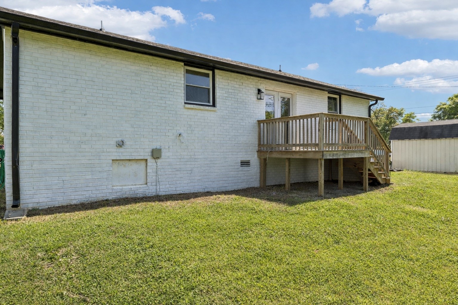 8617 Maple Street Murfreesboro, TN 37129 - Photo 25 of 31 a backyard of a house with large trees and a small yard
