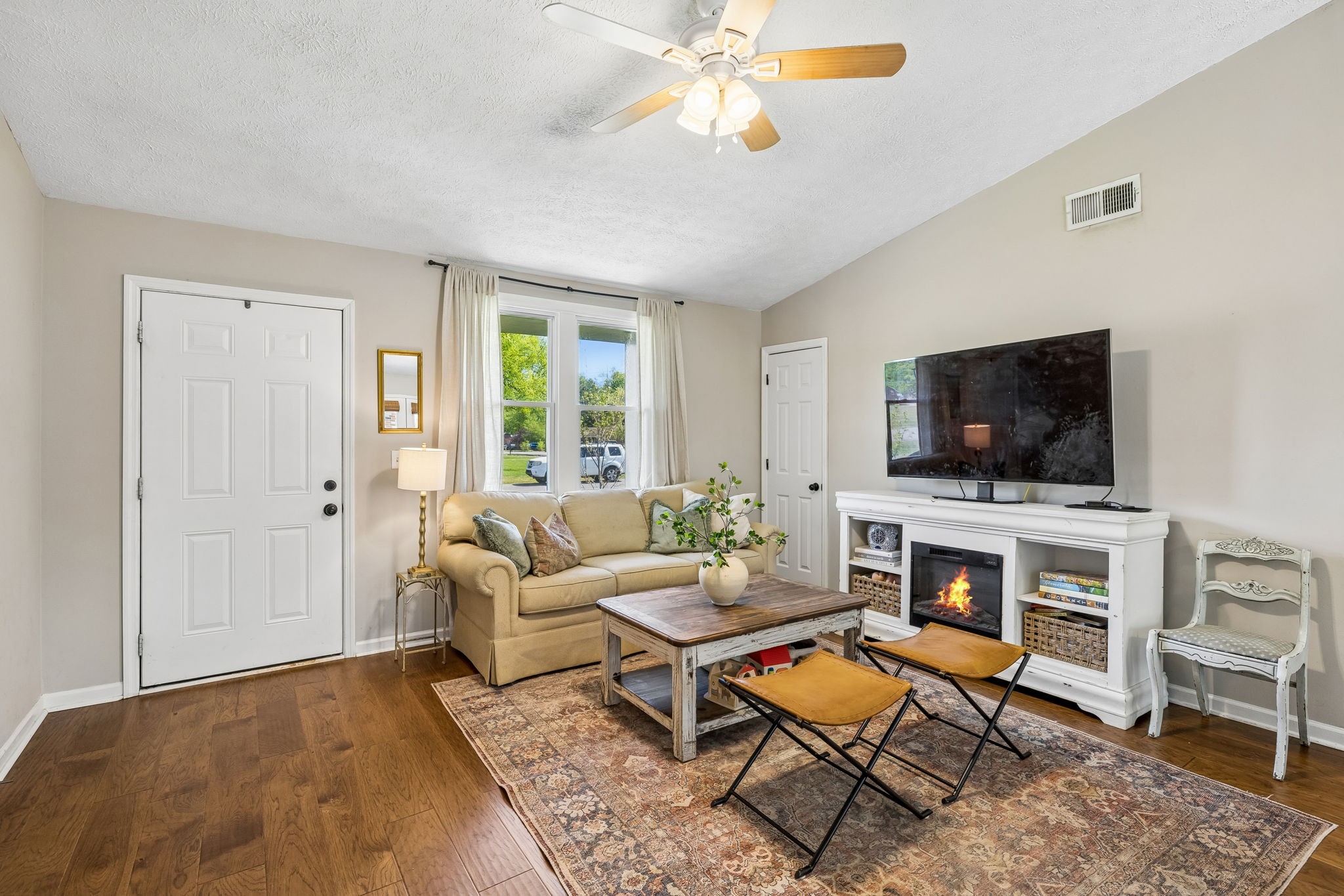 8617 Maple Street Murfreesboro, TN 37129 - Photo 6 of 31 a living room with furniture and a flat screen tv