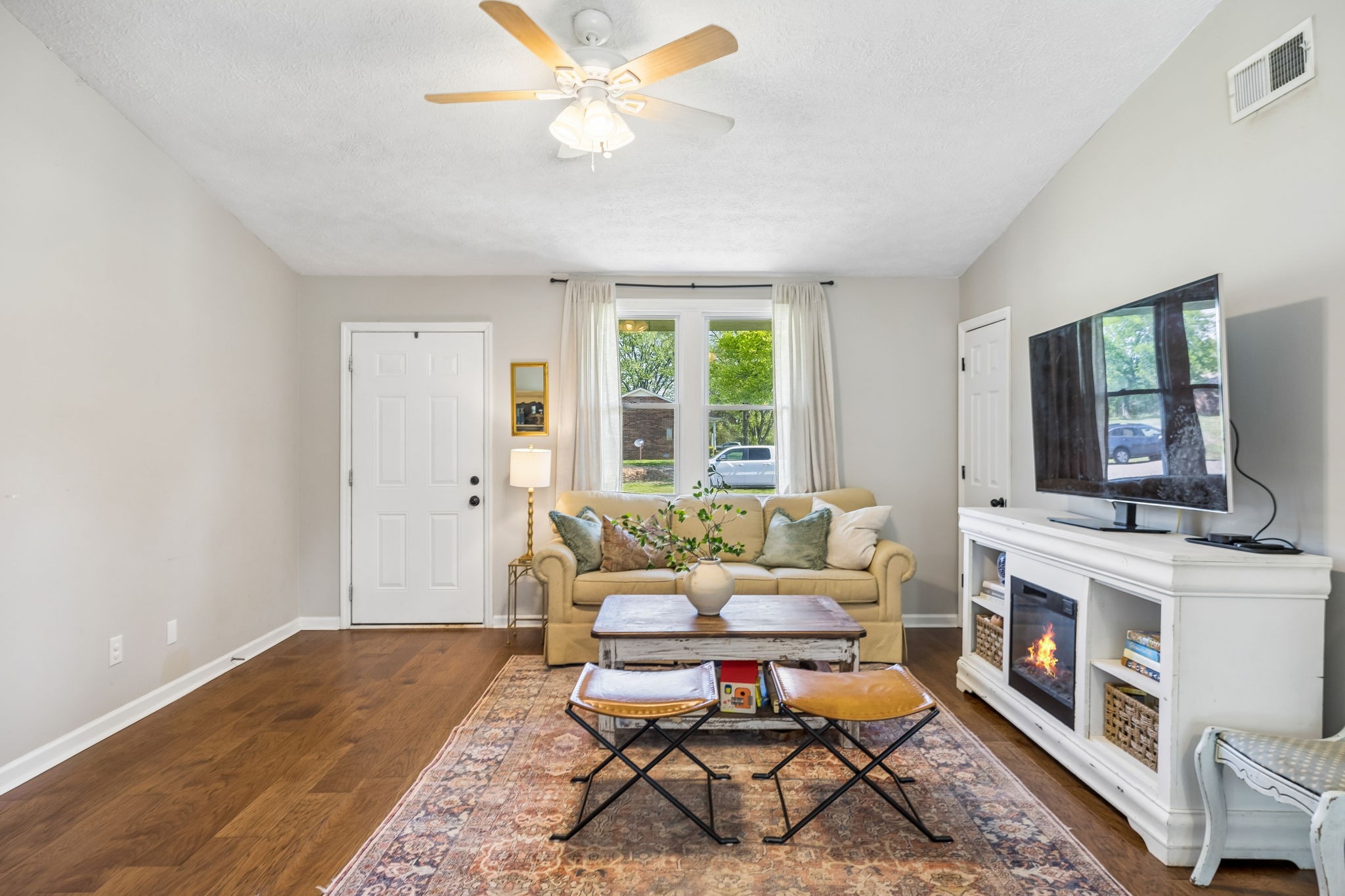 8617 Maple Street Murfreesboro, TN 37129 - Photo 7 of 31 a living room with furniture and a fireplace