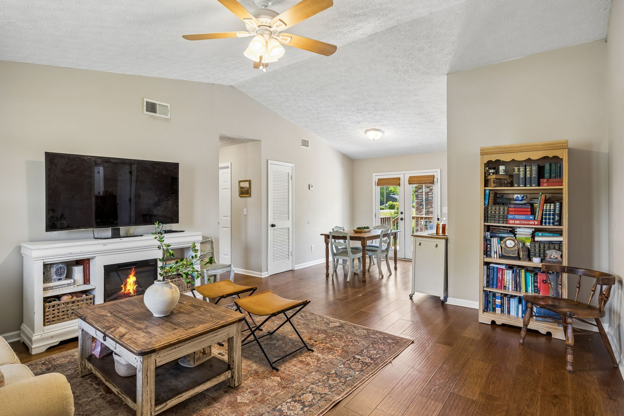 8617 Maple Street Murfreesboro, TN 37129 - Photo 9 of 31 a living room with furniture and a flat screen tv
