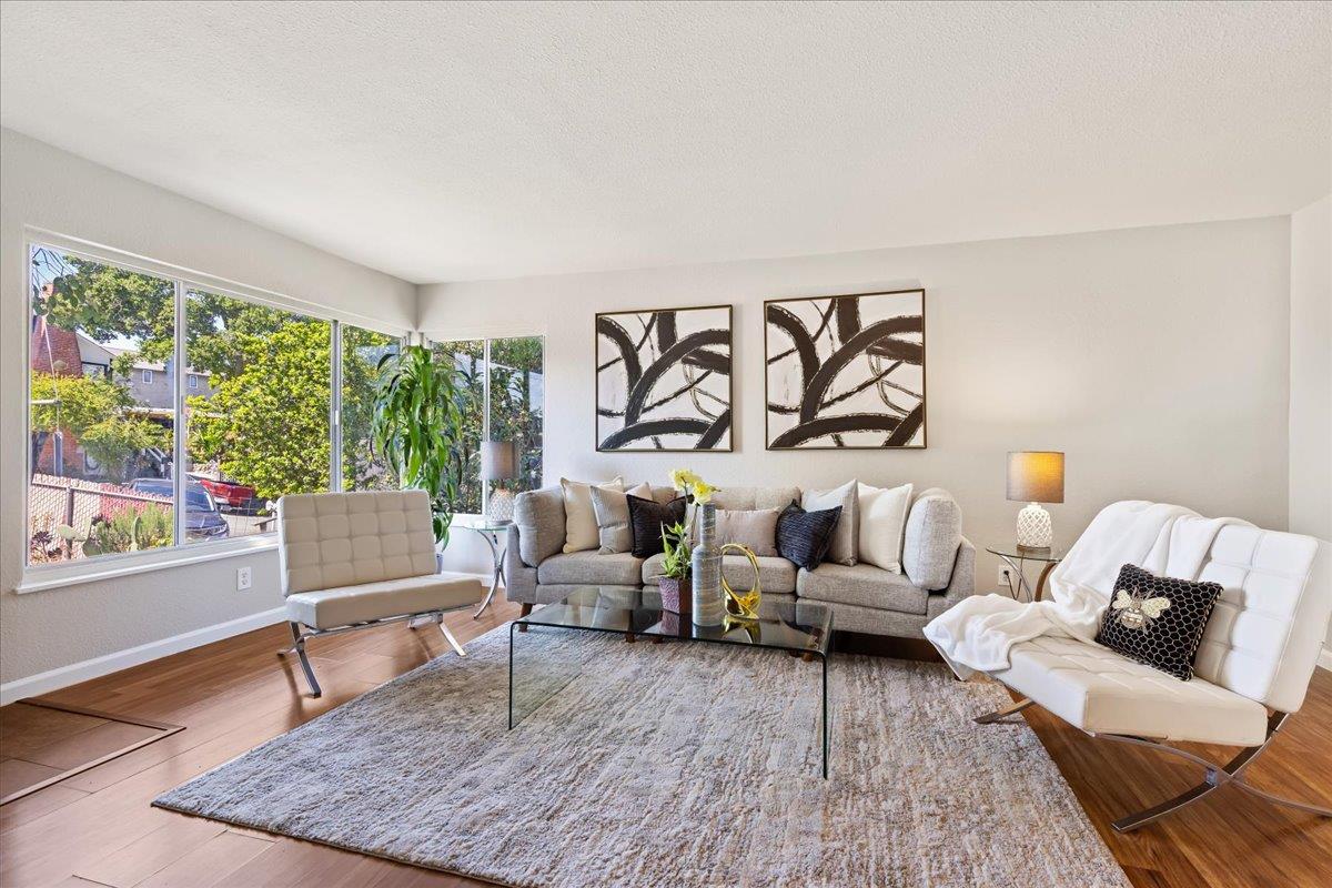 231 Pinole Avenue Rodeo, CA 94572 - Photo 1 of 26 a living room with furniture and a large window