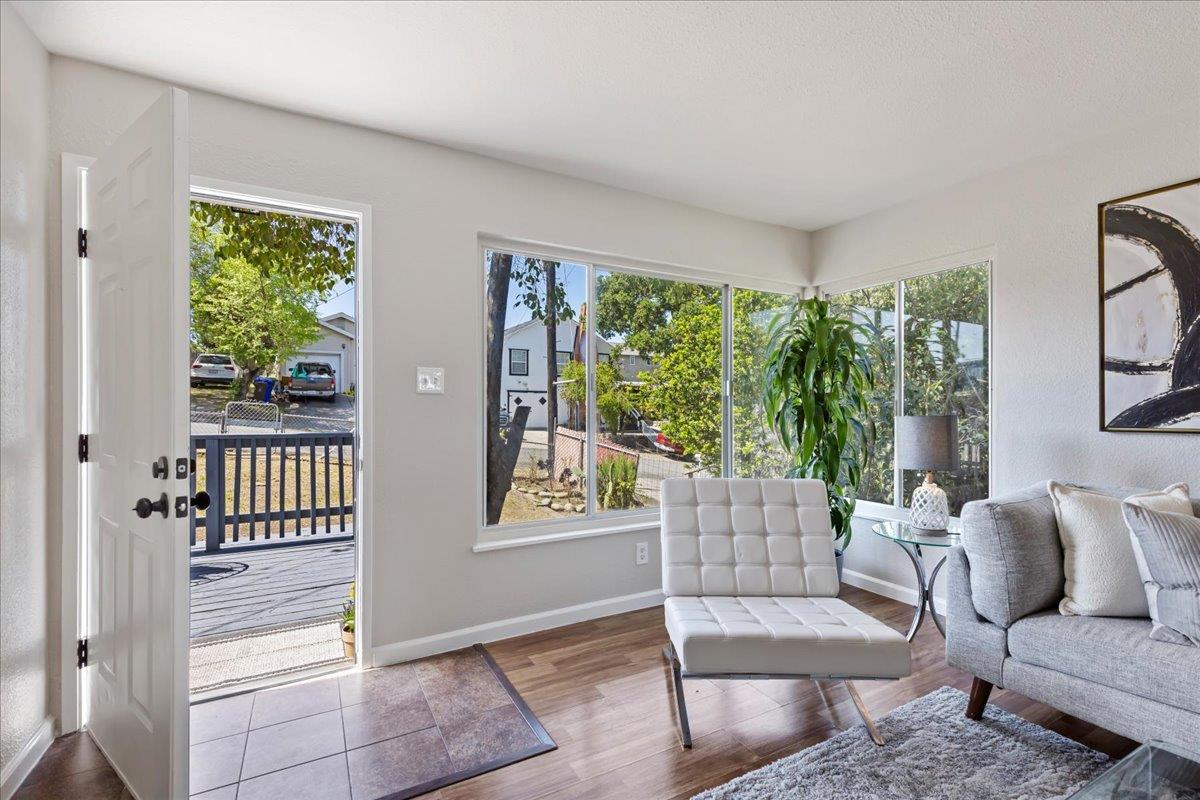 231 Pinole Avenue Rodeo, CA 94572 - Photo 2 of 26 a living room with furniture and a window