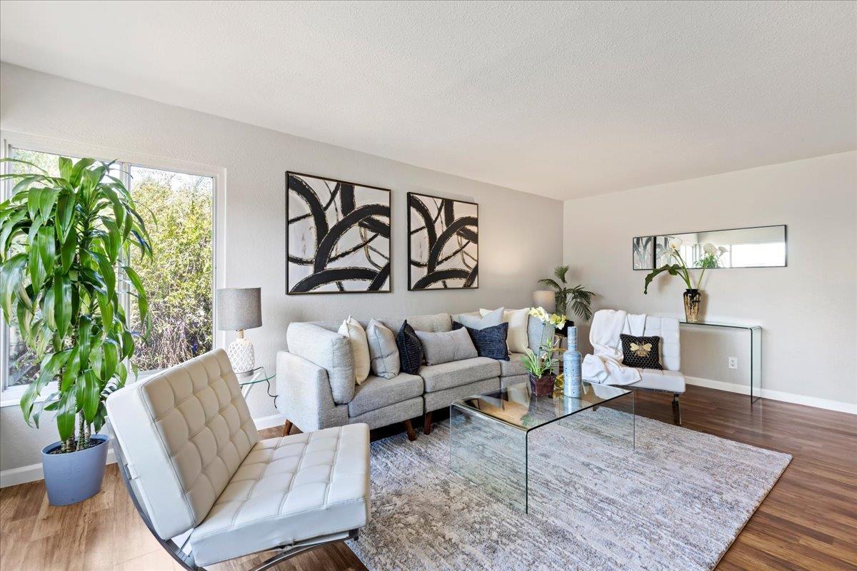 231 Pinole Avenue Rodeo, CA 94572 - Photo 3 of 26 a living room with furniture and wooden floor