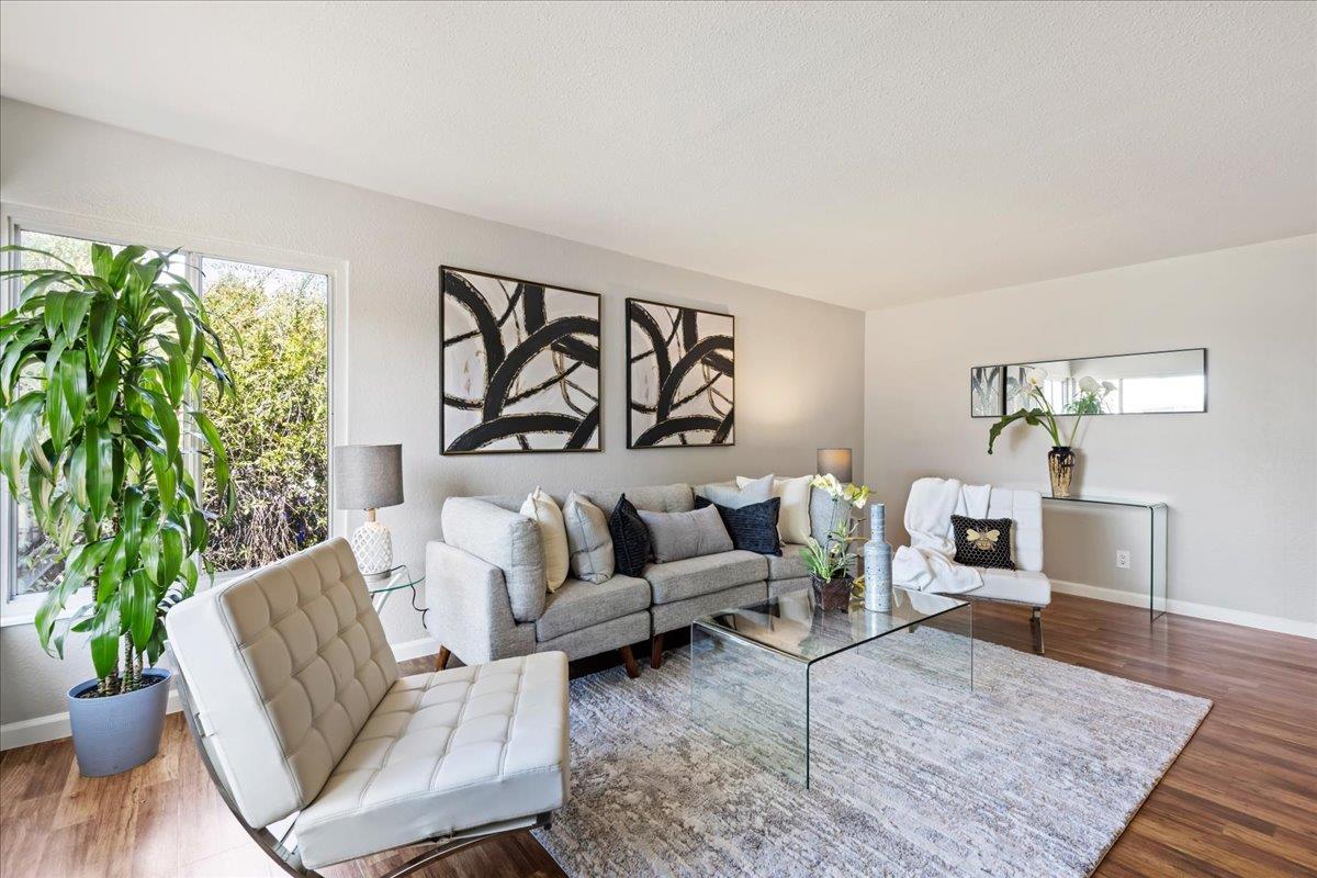 231 Pinole Avenue Rodeo, CA 94572 - Photo 4 of 26 a living room with furniture and a potted plant