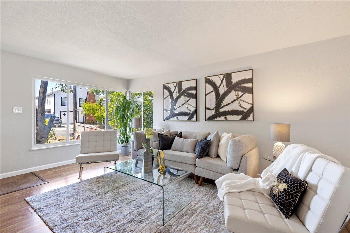 231 Pinole Avenue Rodeo, CA 94572 - Photo 5 of 26 a living room with furniture large window and wooden floor