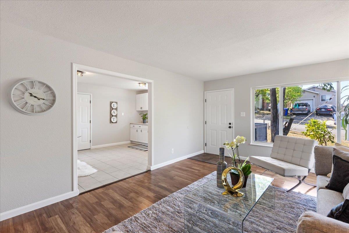231 Pinole Avenue Rodeo, CA 94572 - Photo 6 of 26 a living room with furniture and a table