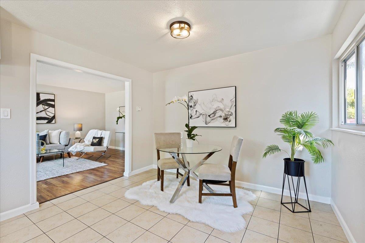 231 Pinole Avenue Rodeo, CA 94572 - Photo 9 of 26 a view of a livingroom with furniture and a potted plant