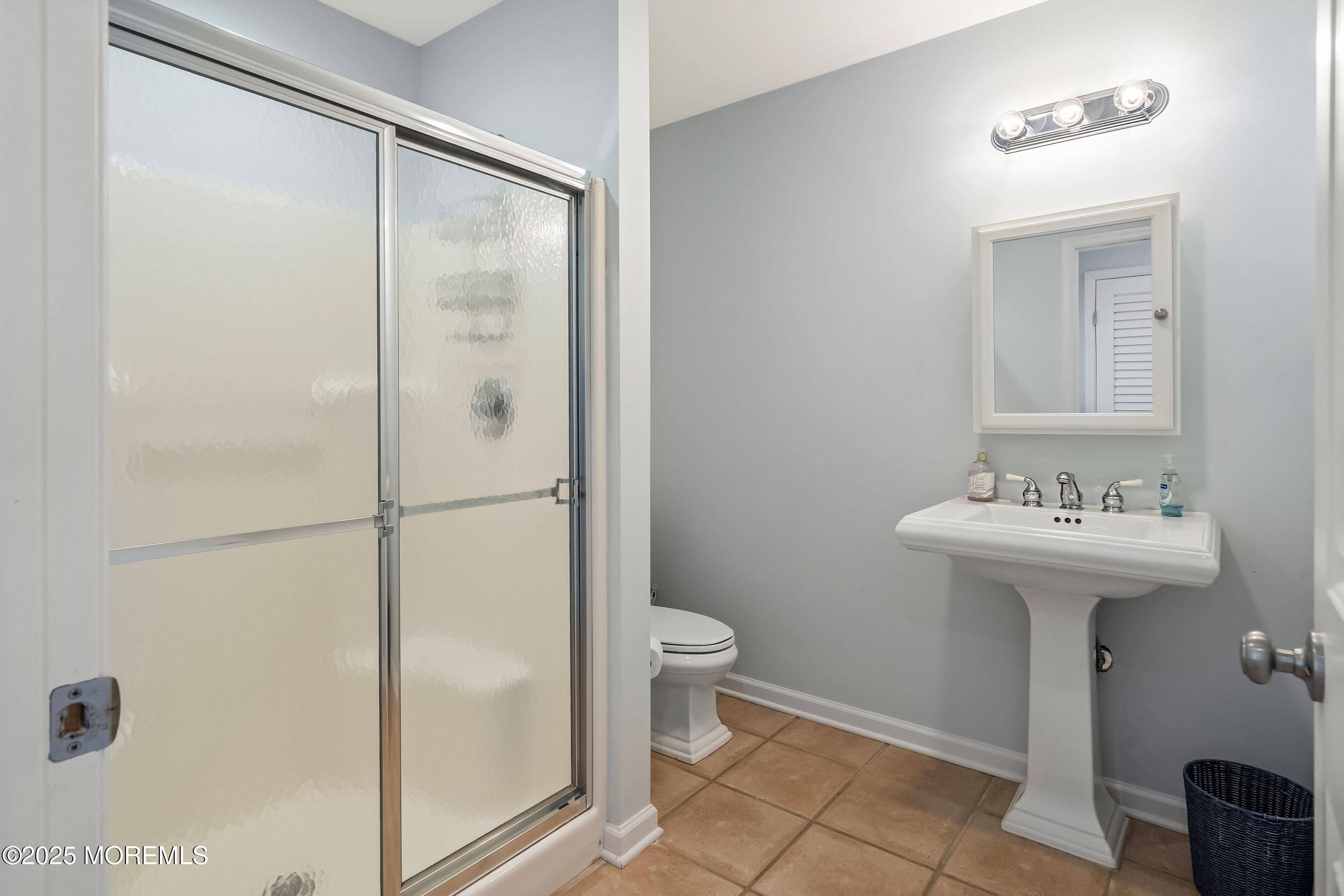 21 Magee Avenue Lavallette, NJ 08735 - Photo 11 of 25 a bathroom with a sink toilet and shower