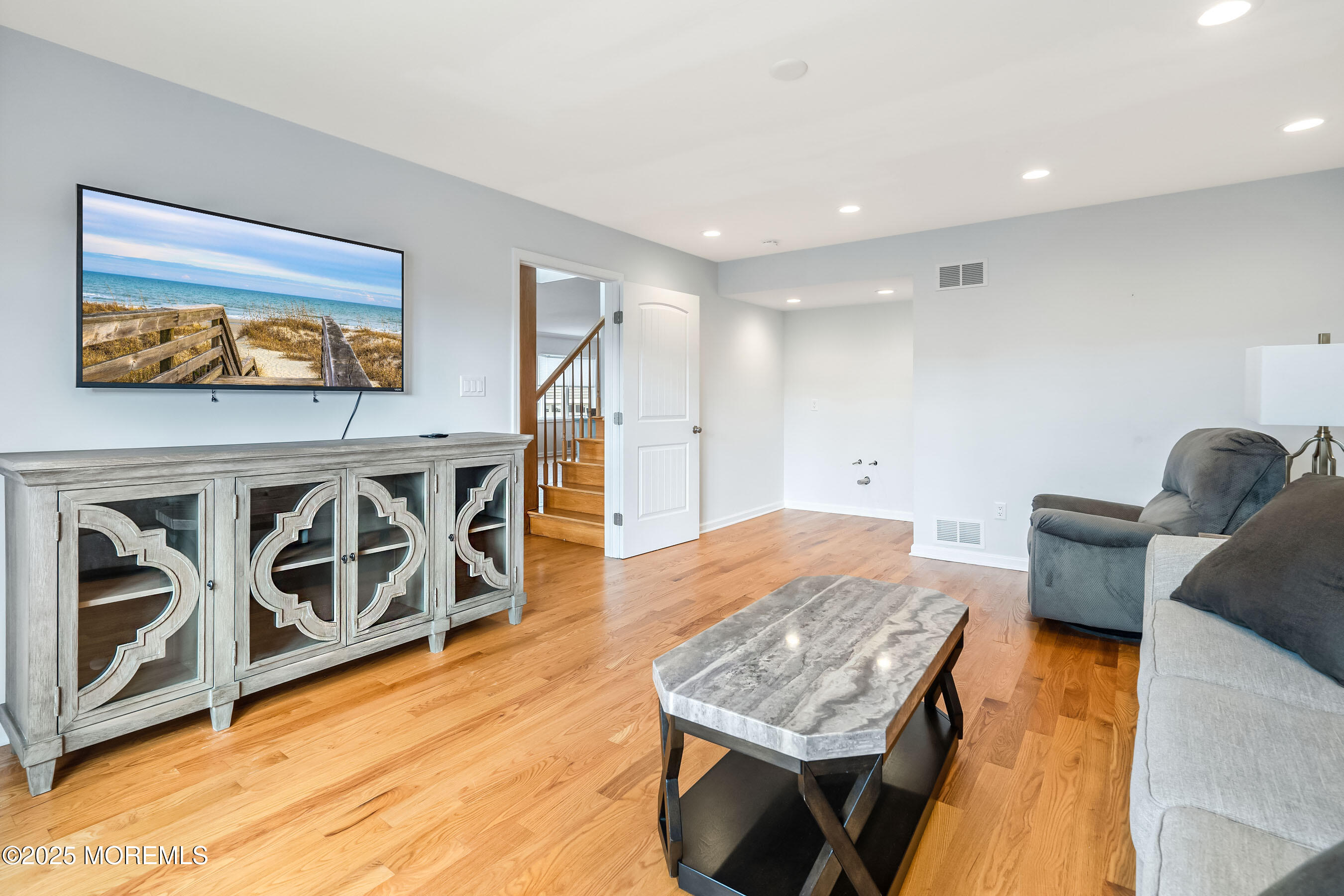 21 Magee Avenue Lavallette, NJ 08735 - Photo 12 of 25 a living room with furniture and a flat screen tv