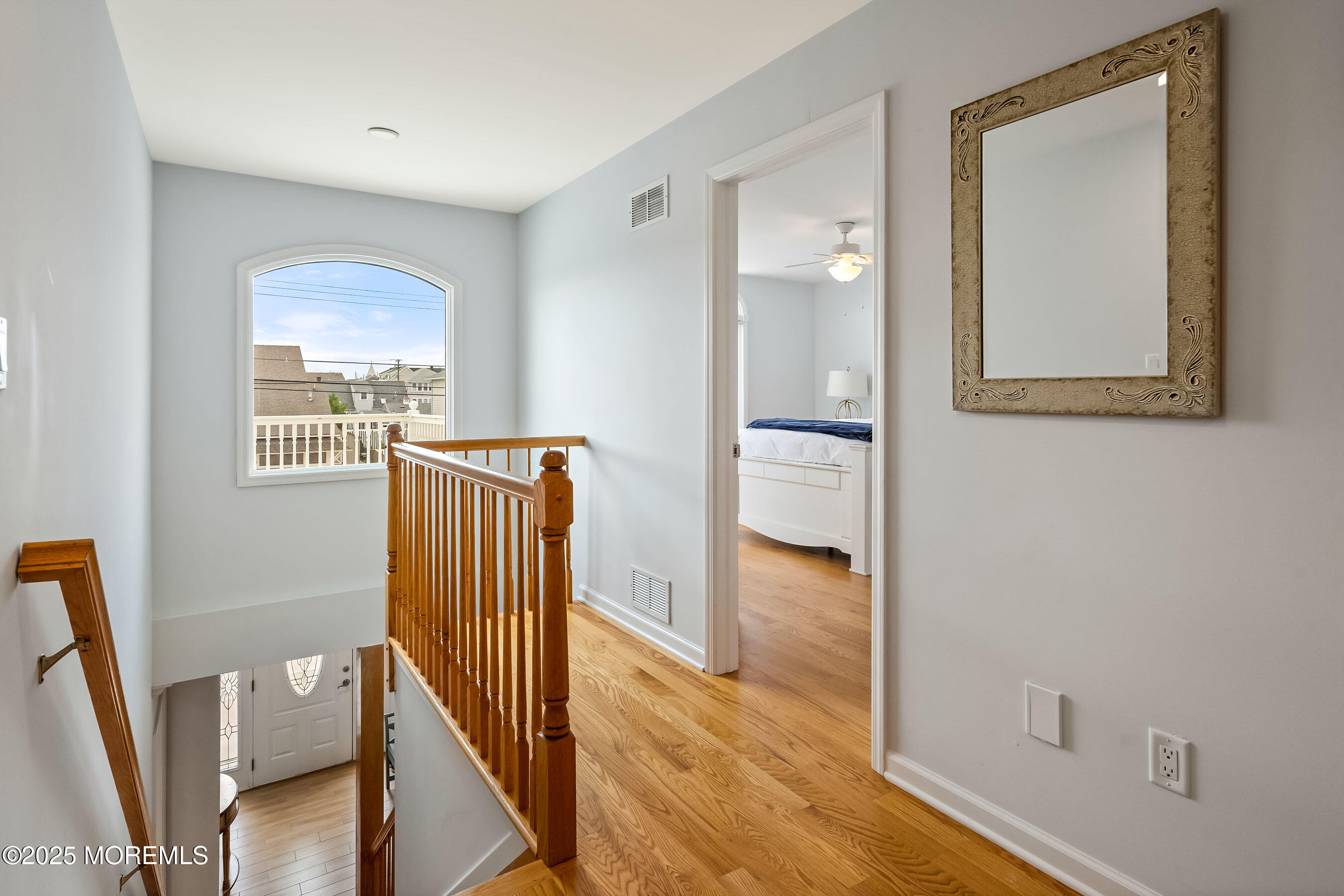 21 Magee Avenue Lavallette, NJ 08735 - Photo 13 of 25 a view of a hallway with wooden floor and a livingroom