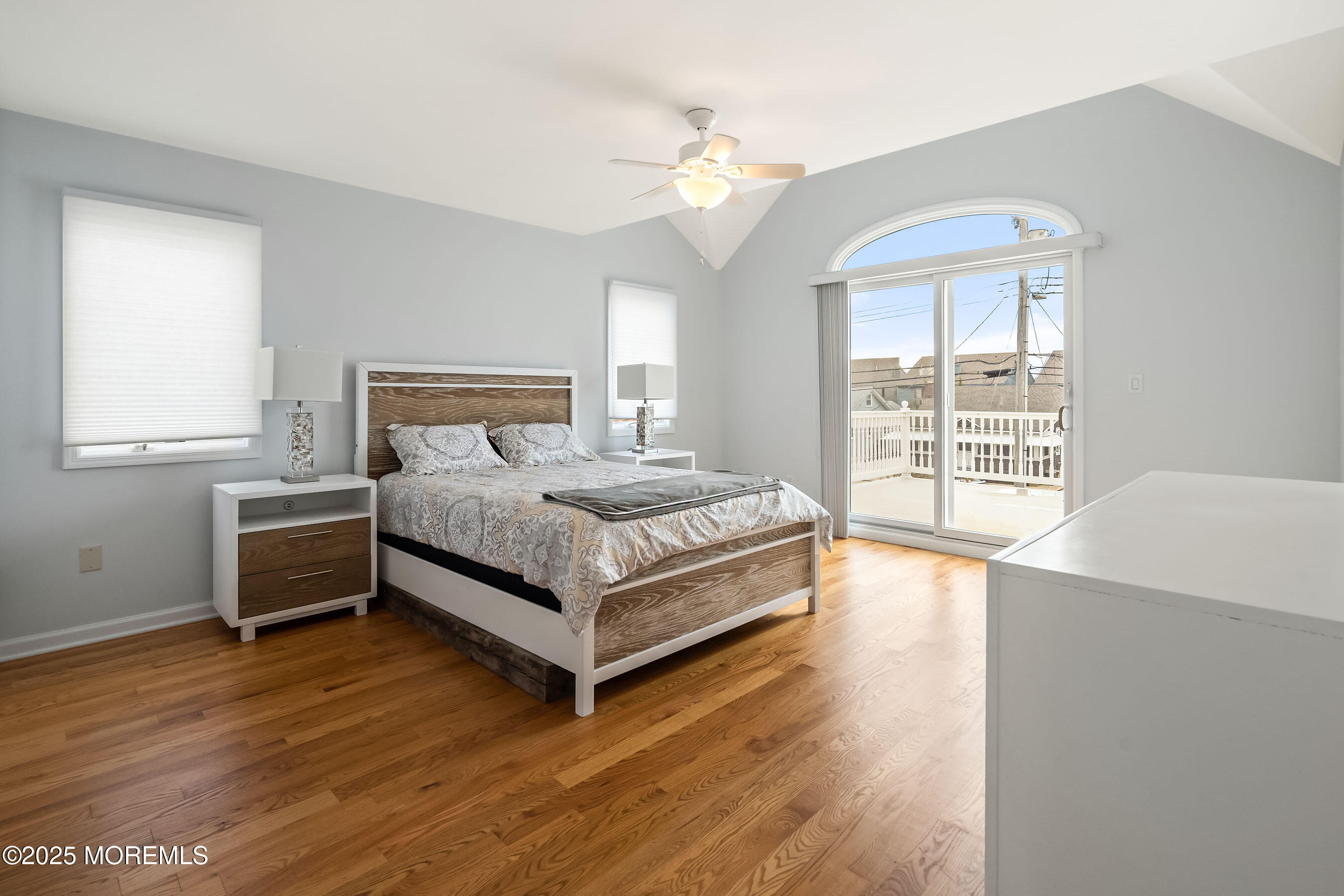 21 Magee Avenue Lavallette, NJ 08735 - Photo 20 of 25 a bedroom with a bed and a large window
