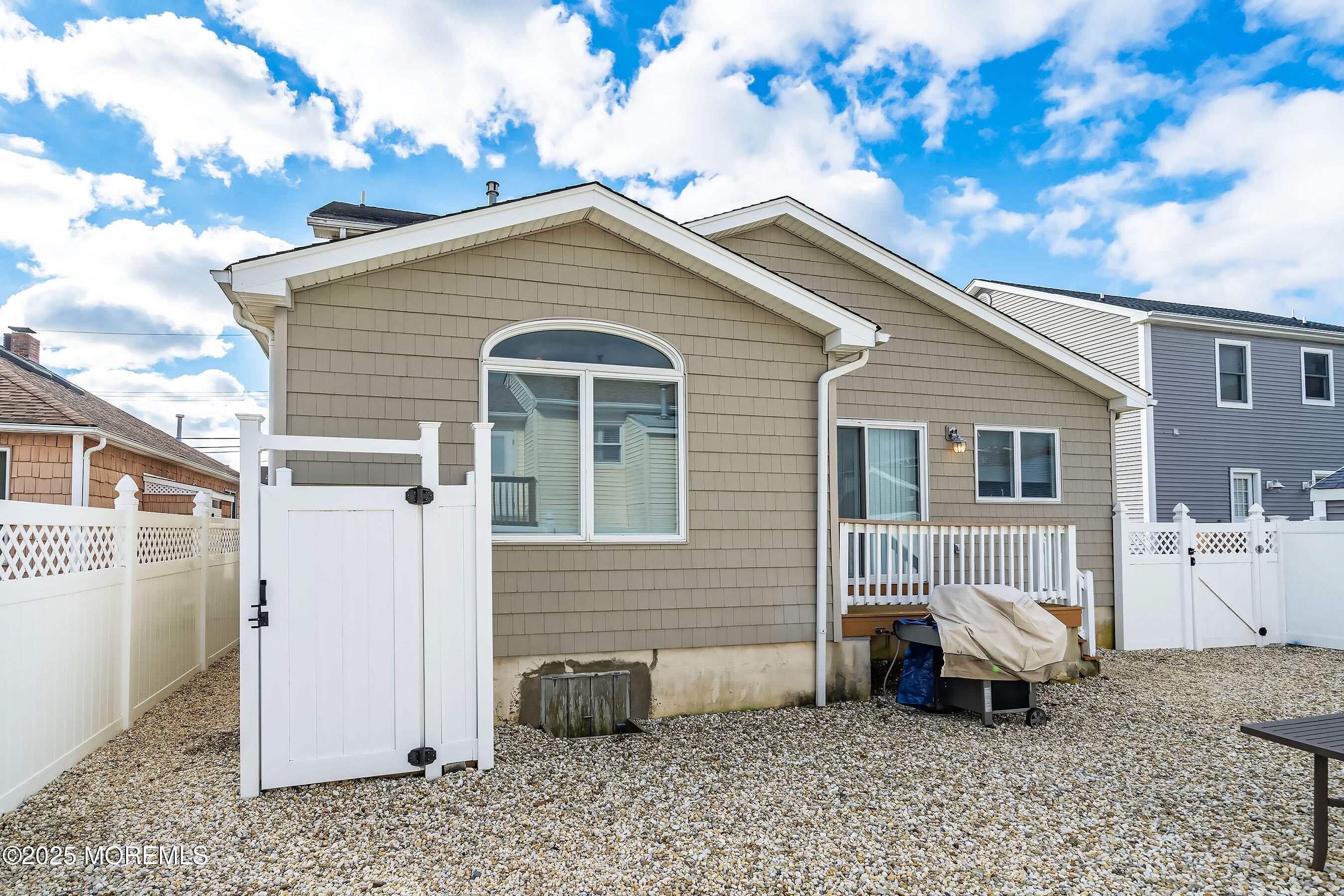 21 Magee Avenue Lavallette, NJ 08735 - Photo 21 of 25 a backyard of a house with white walls