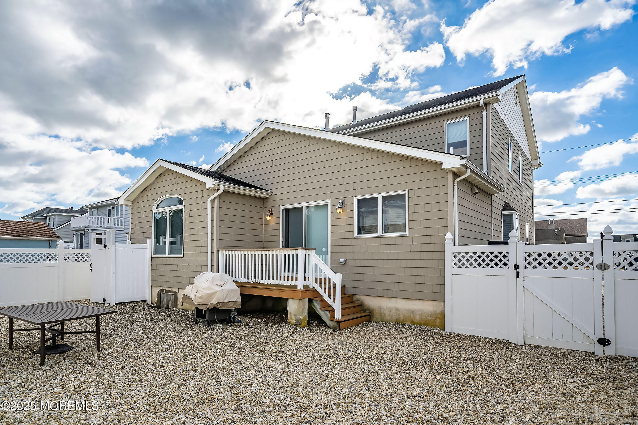 21 Magee Avenue Lavallette, NJ 08735 - Photo 22 of 25 a view of a house with a yard and roof