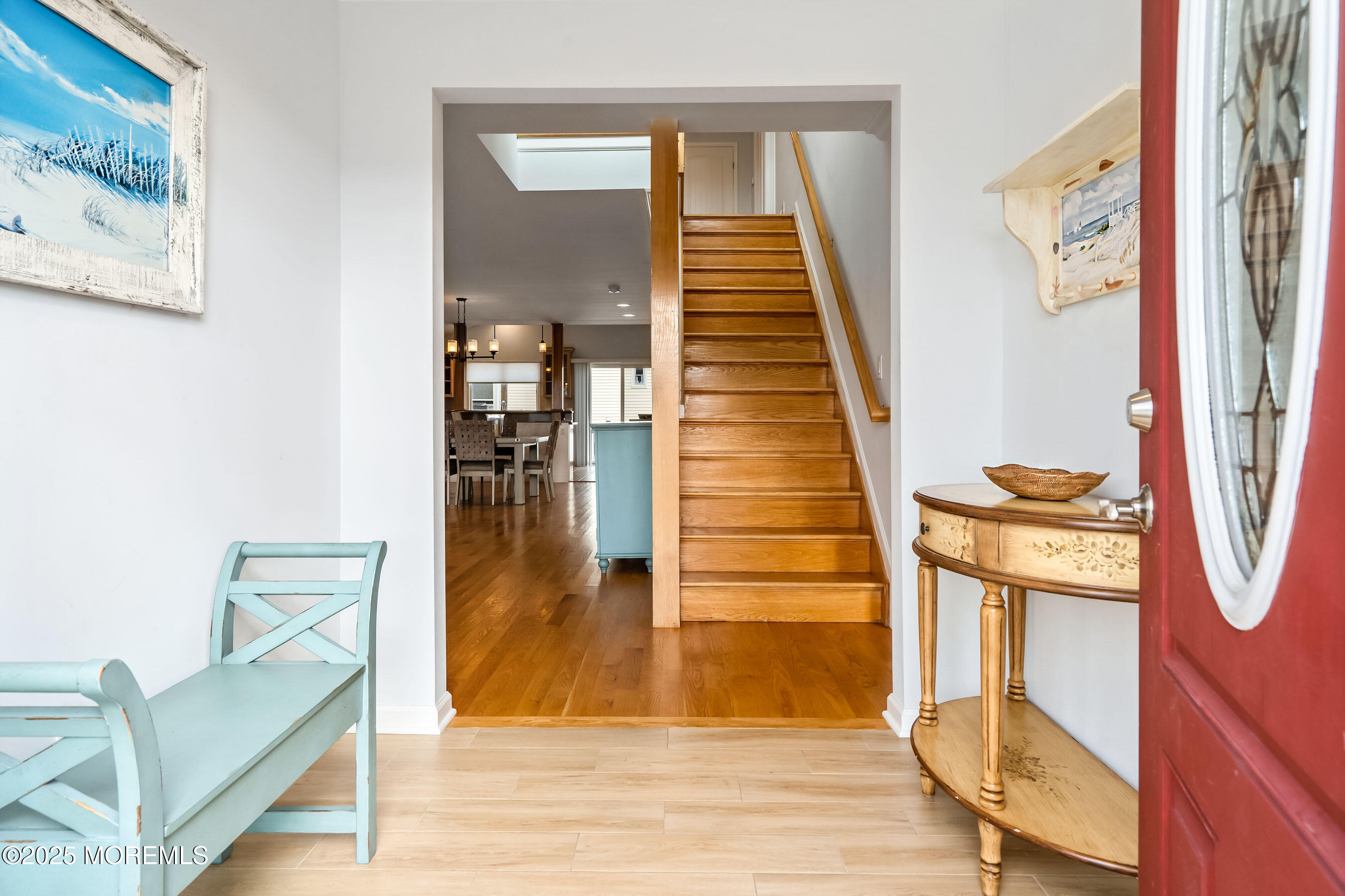21 Magee Avenue Lavallette, NJ 08735 - Photo 4 of 25 a view of a hallway with wooden floor and staircase