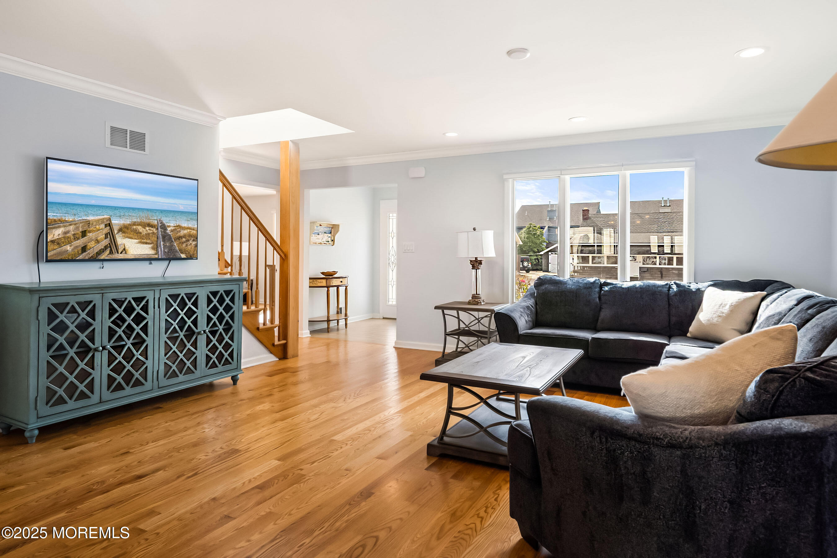 21 Magee Avenue Lavallette, NJ 08735 - Photo 6 of 25 a living room with furniture and a painting on the wall