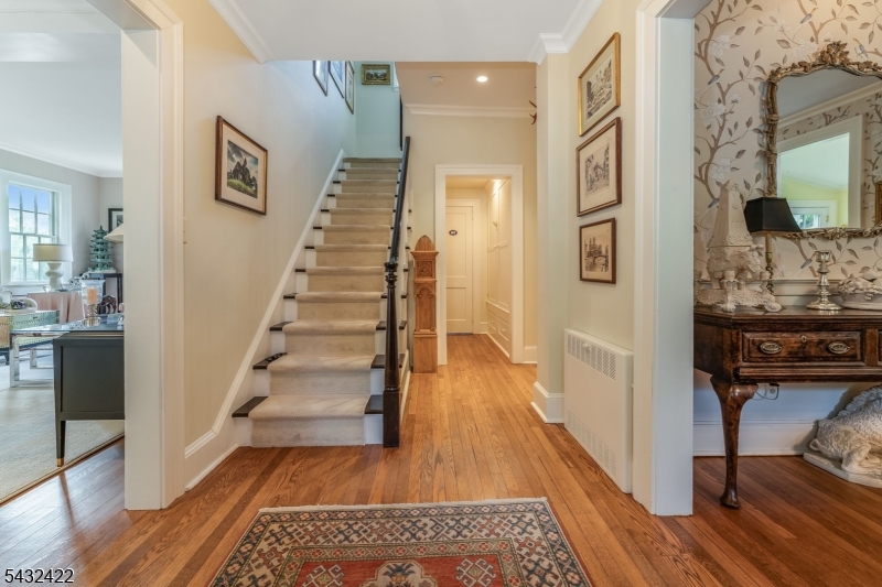 11 New Street Mendham, NJ 07945 - Photo 4 of 35 a view of a hallway with wooden floor and staircase