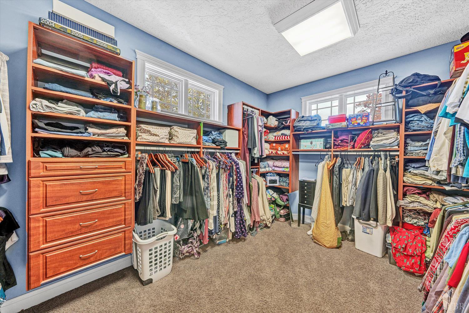 803 Compass Cove Circle Moneta, VA 24121 - Photo 17 of 92 a view of walk in closet with clothes