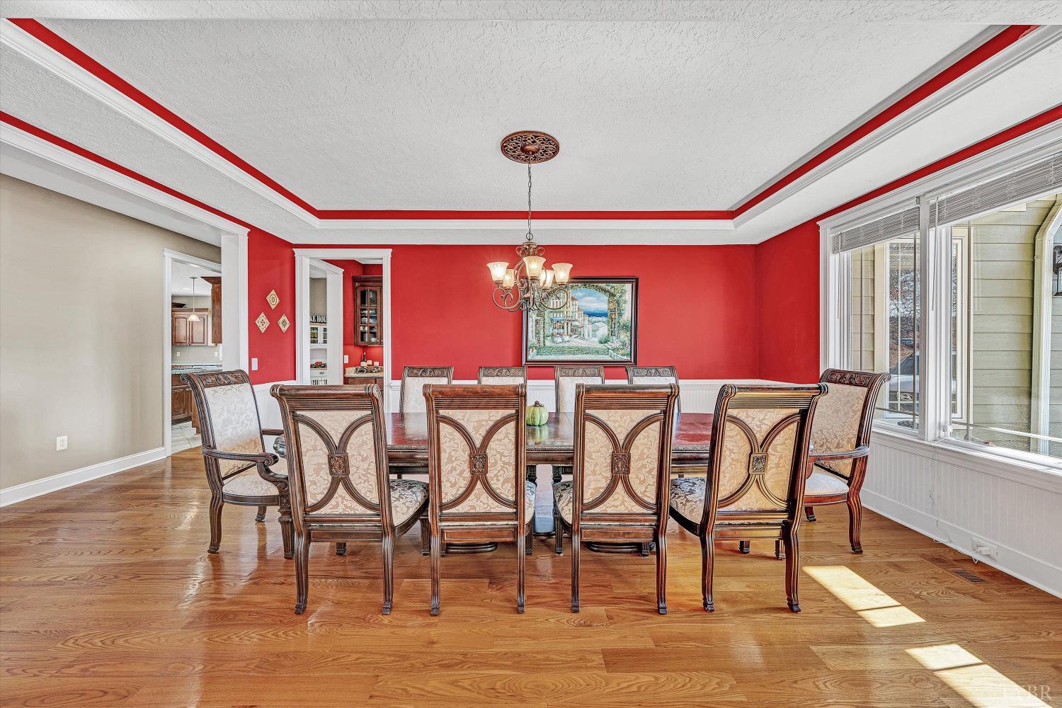 803 Compass Cove Circle Moneta, VA 24121 - Photo 18 of 92 a view of a dining room with furniture window and wooden floor