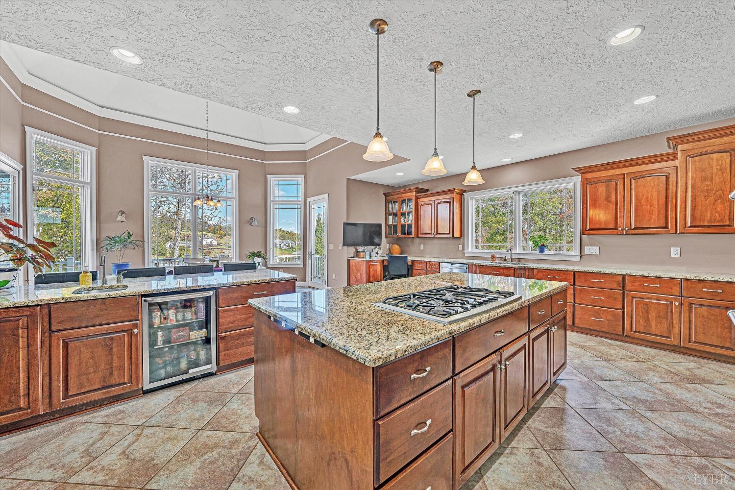 803 Compass Cove Circle Moneta, VA 24121 - Photo 30 of 92 a kitchen with stainless steel appliances granite countertop stove top oven and cabinets