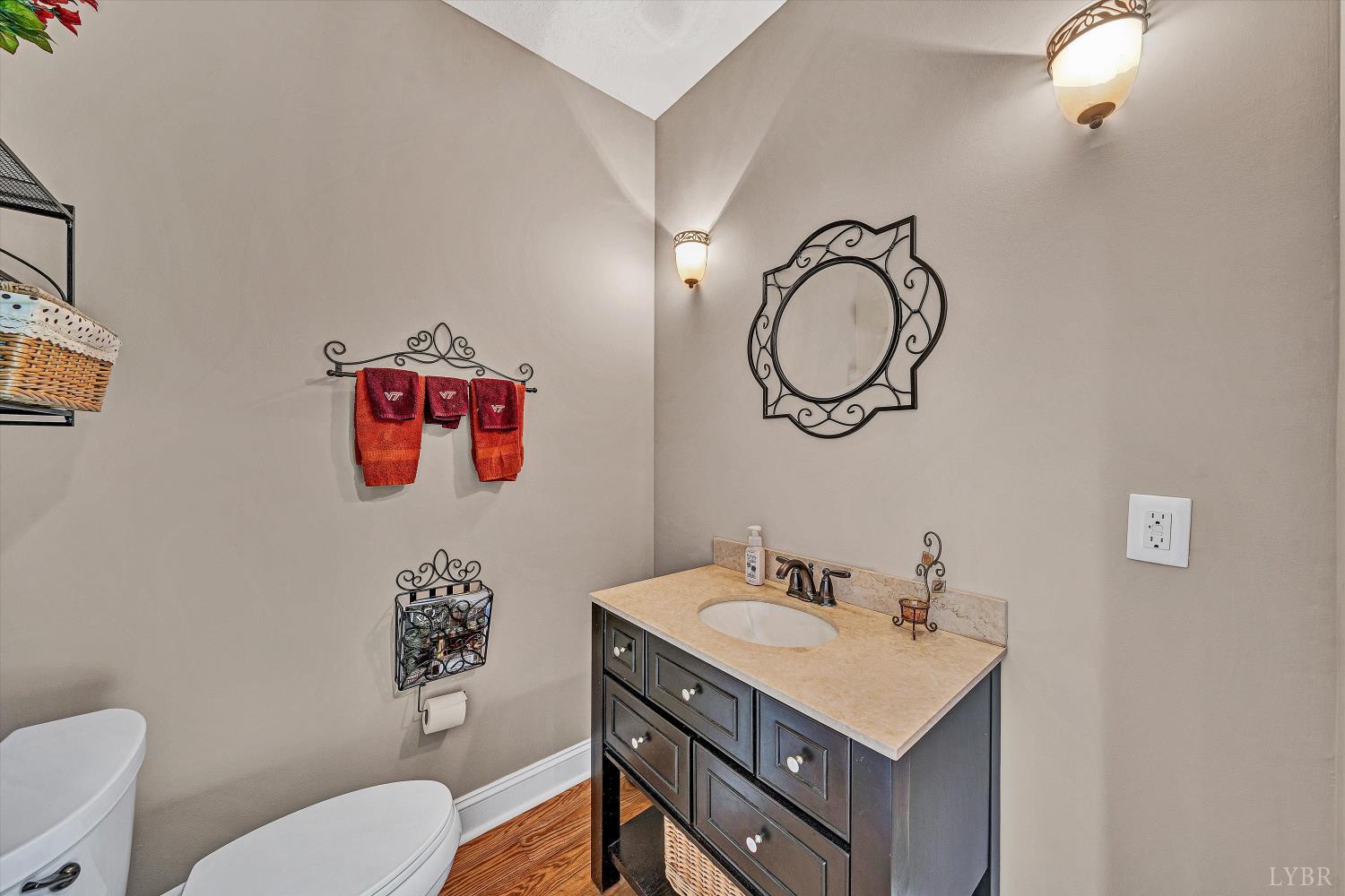 803 Compass Cove Circle Moneta, VA 24121 - Photo 33 of 92 a bathroom with a sink vanity mirror and toilet