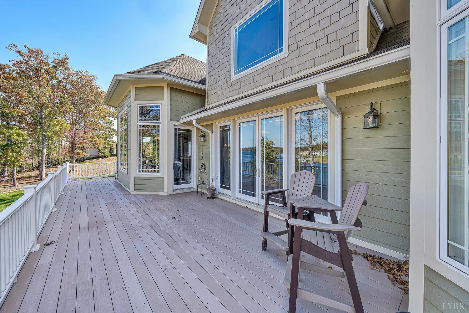803 Compass Cove Circle Moneta, VA 24121 - Photo 39 of 92 a view of a house with backyard and sitting area