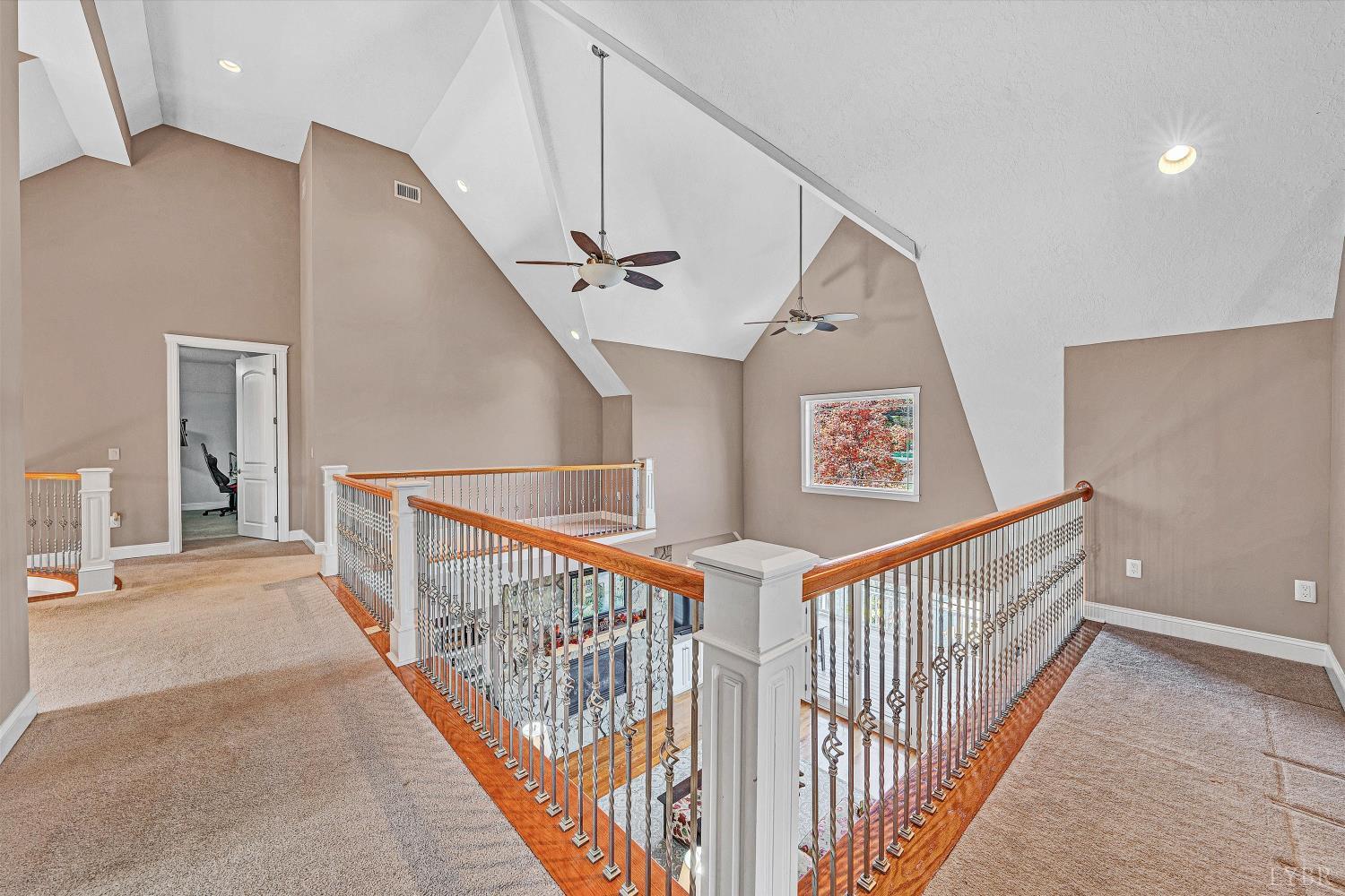 803 Compass Cove Circle Moneta, VA 24121 - Photo 44 of 92 a view of staircase with railing and white walls