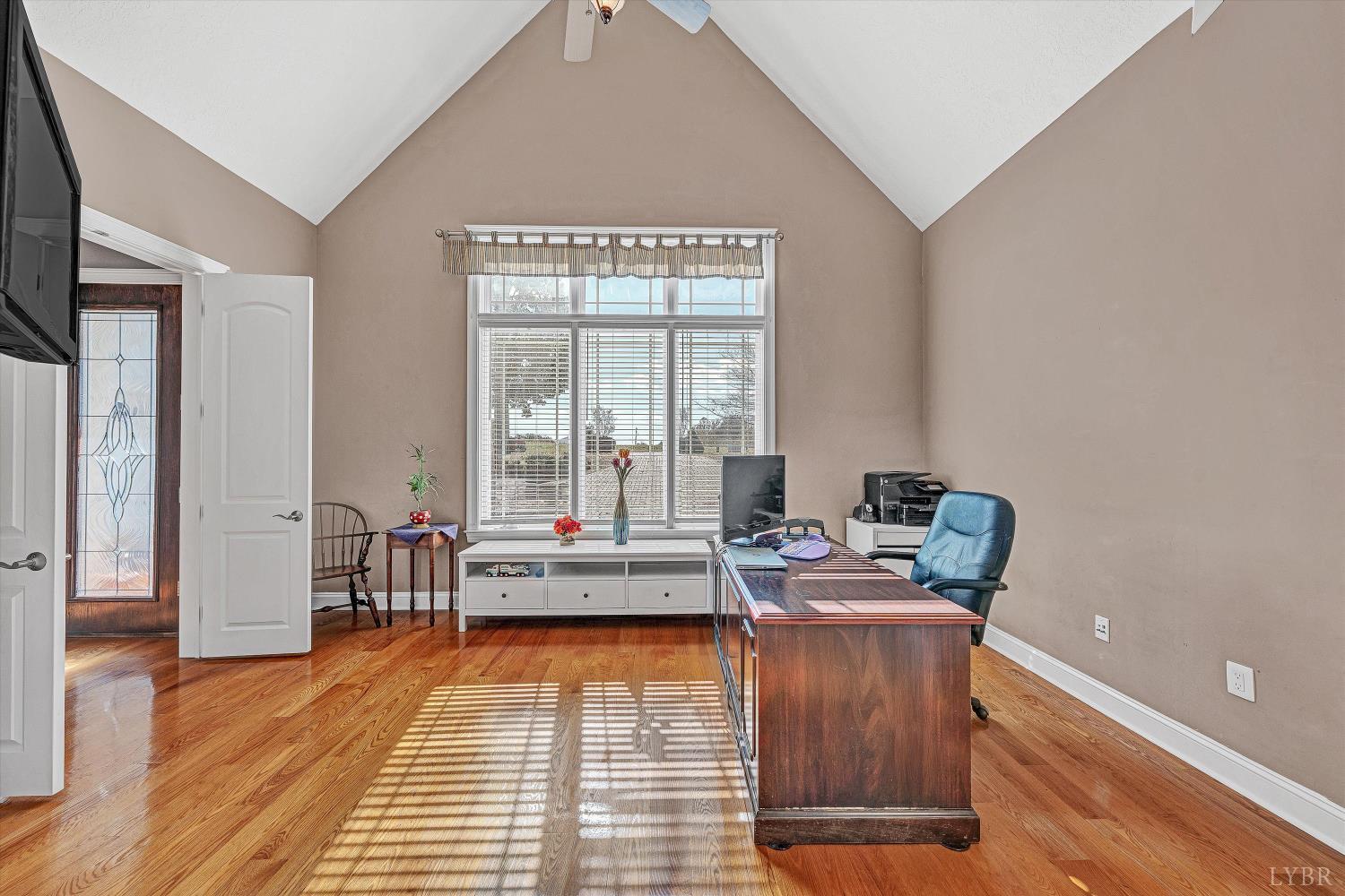 803 Compass Cove Circle Moneta, VA 24121 - Photo 8 of 92 a living room with furniture and floor to ceiling windows