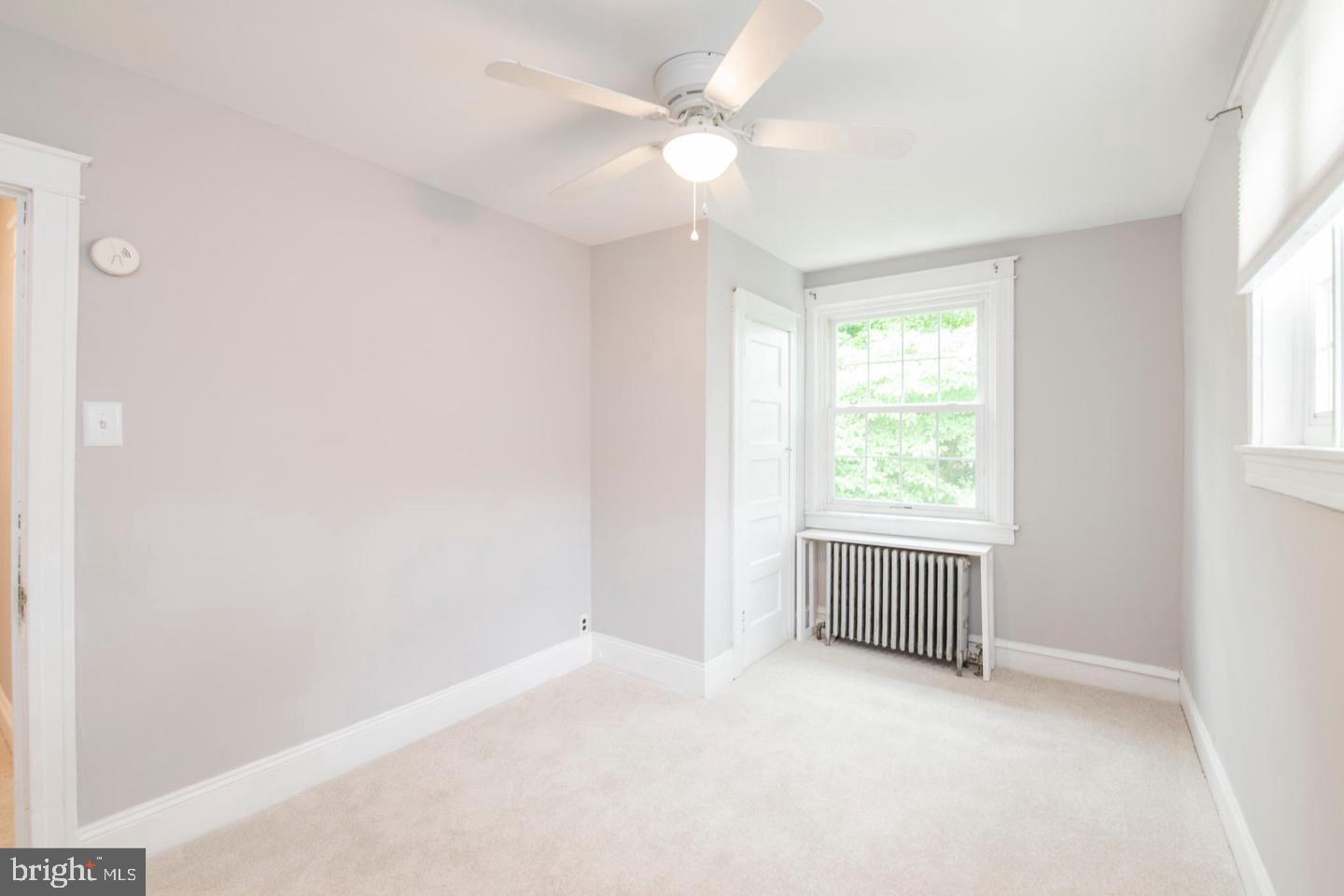 763 Humphreys Road Ardmore, PA 19003 - Photo 15 of 28 an empty room with a window and a fan