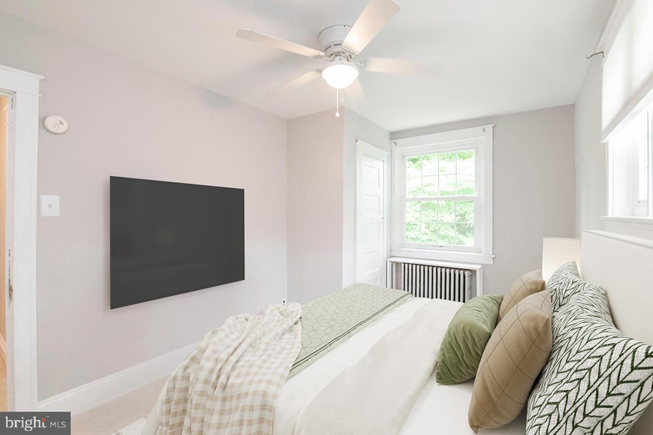 763 Humphreys Road Ardmore, PA 19003 - Photo 16 of 28 a bedroom with a bed and a flat screen tv