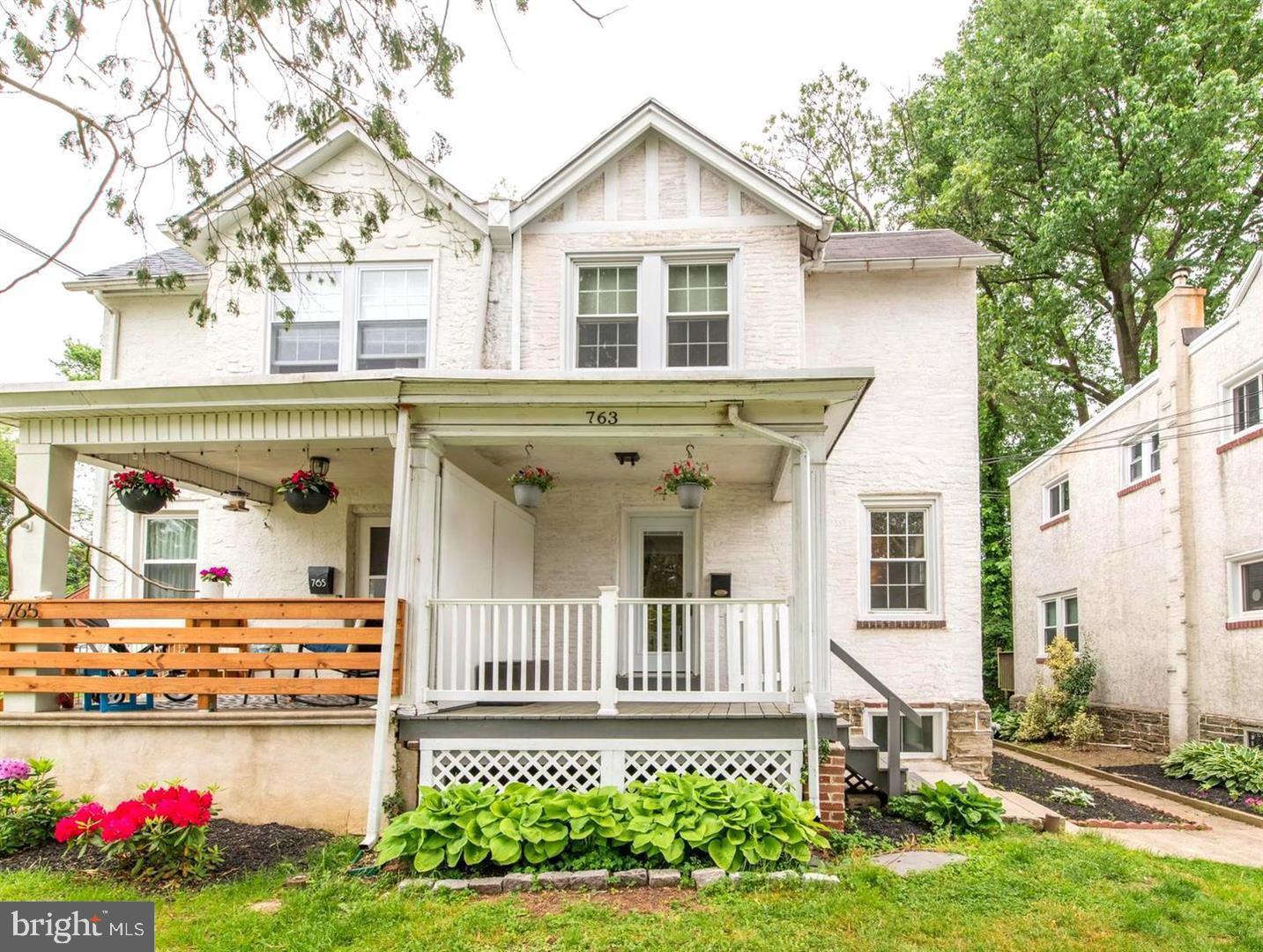 763 Humphreys Road Ardmore, PA 19003 - Photo 2 of 28 a front view of a house with garden