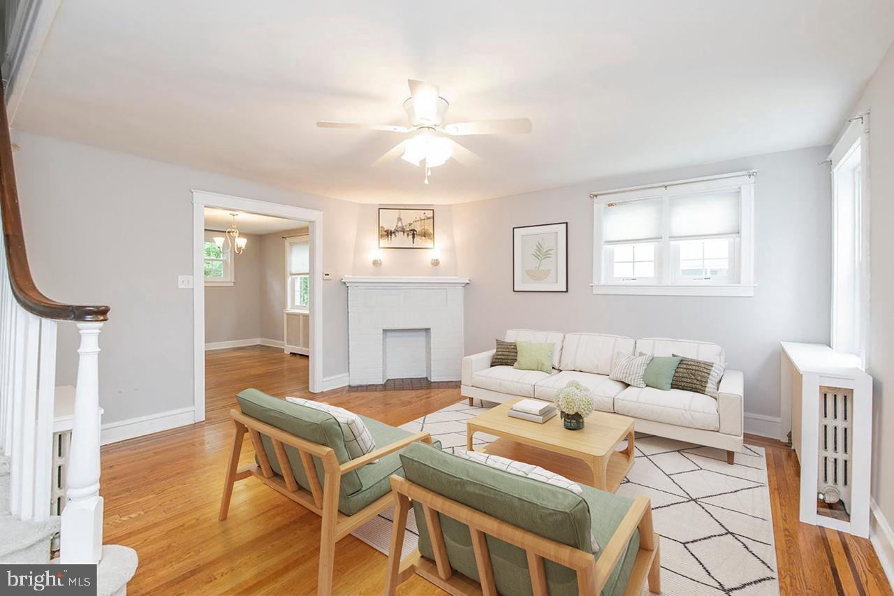 763 Humphreys Road Ardmore, PA 19003 - Photo 4 of 28 a living room with furniture a fireplace and a window