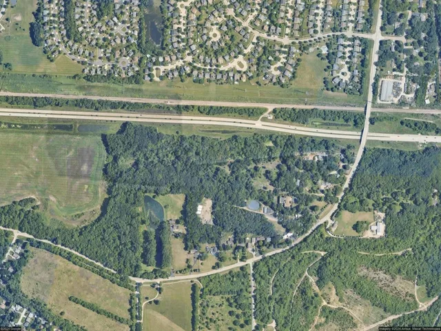 a view of fountain in the middle of a yard