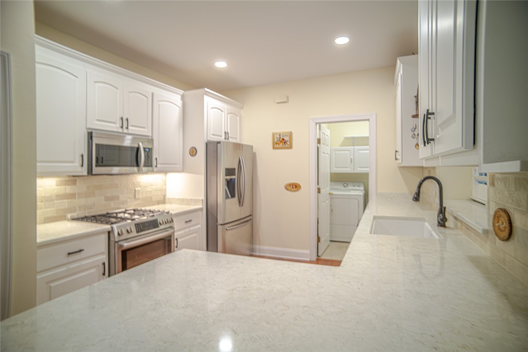 409 Colley Lane St. Simons Island, GA 31522 - Photo 6 of 18 Kitchen to Laundry