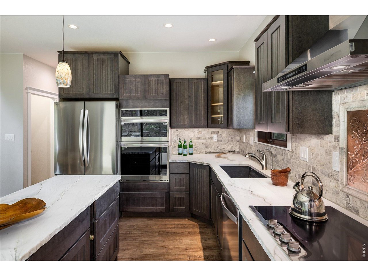 713 Rudi Lane Golden, CO 80403 - Photo 13 of 49 a kitchen with stainless steel appliances a sink stove and refrigerator