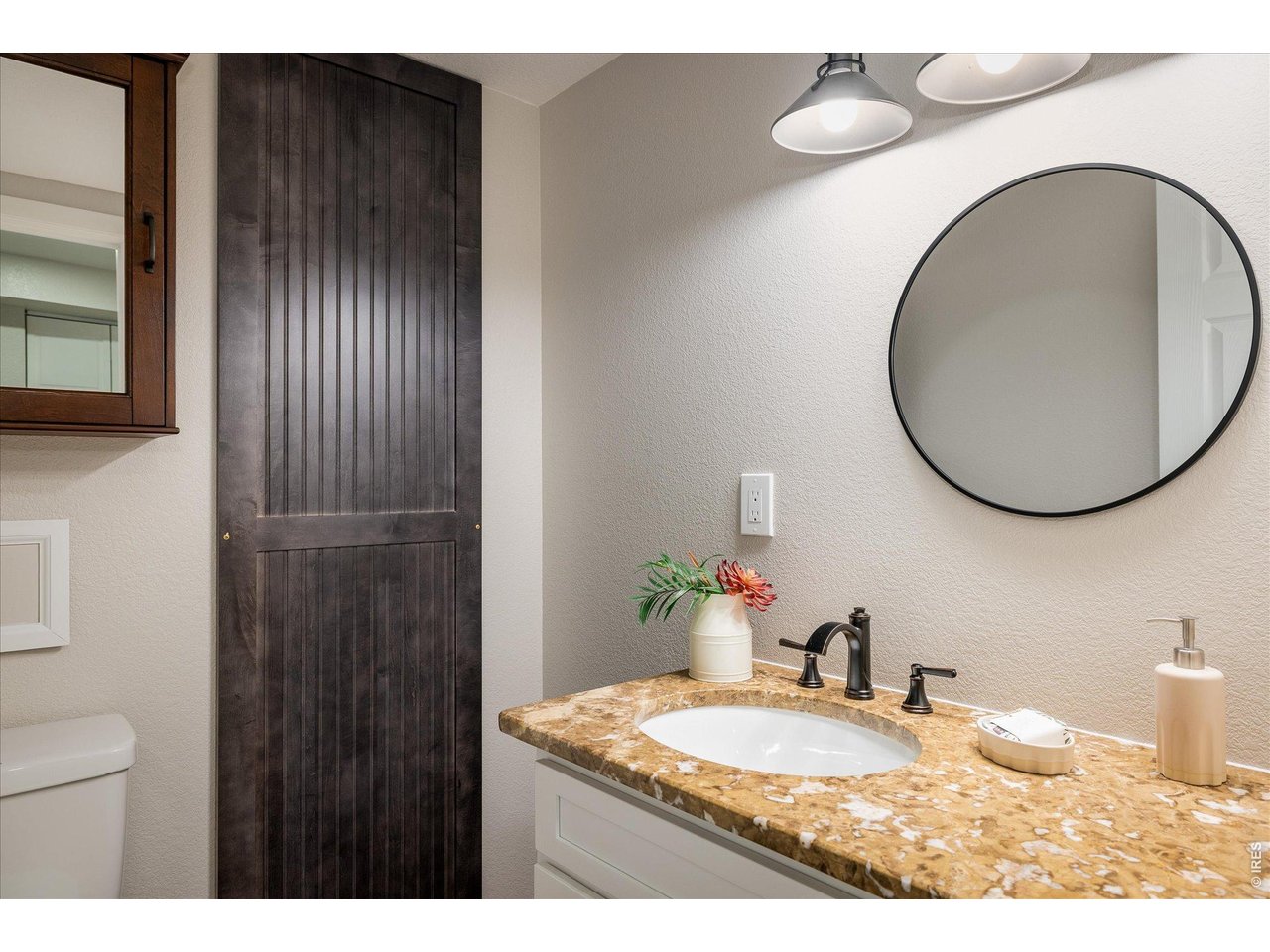 713 Rudi Lane Golden, CO 80403 - Photo 37 of 49 a bathroom with a granite countertop sink and a mirror