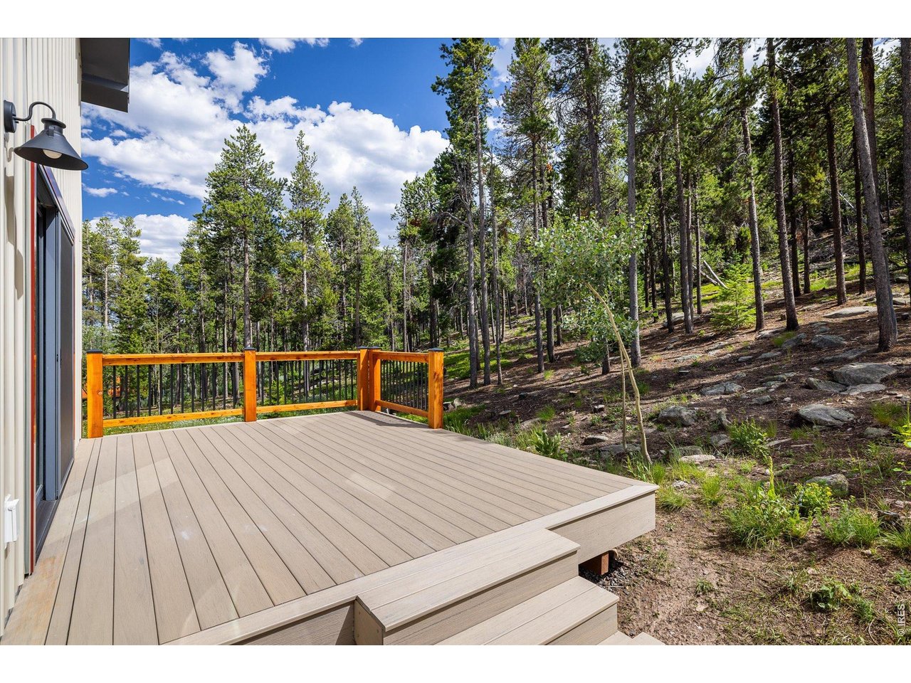 713 Rudi Lane Golden, CO 80403 - Photo 38 of 49 a view of a wooden deck with a backyard