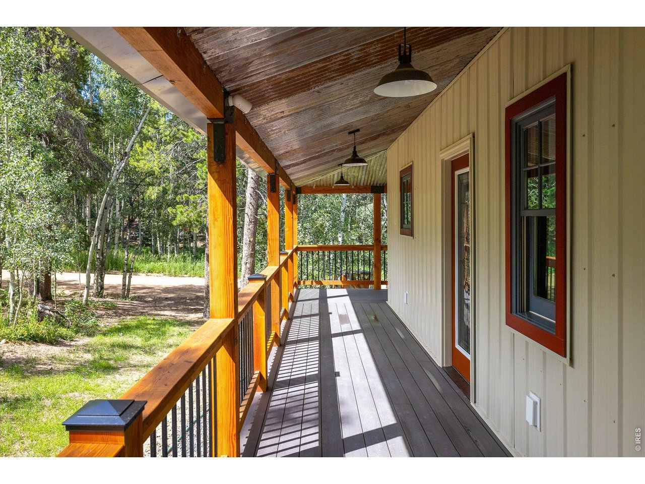 713 Rudi Lane Golden, CO 80403 - Photo 6 of 49 a view of balcony with wooden floor and outdoor space