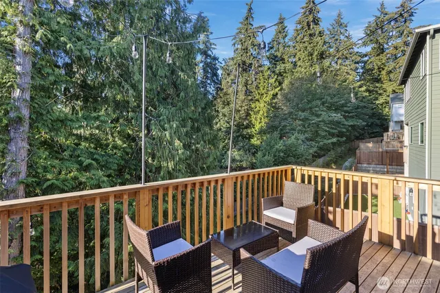 a view of a chair and table on the deck