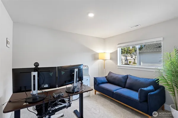a living room with furniture rug and window