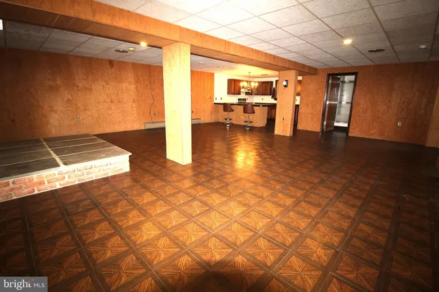 a lobby with furniture and floor to ceiling window