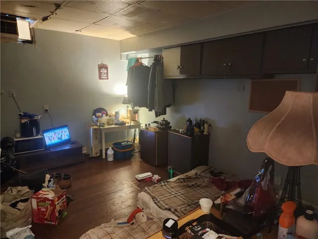 a bedroom with bed and a window