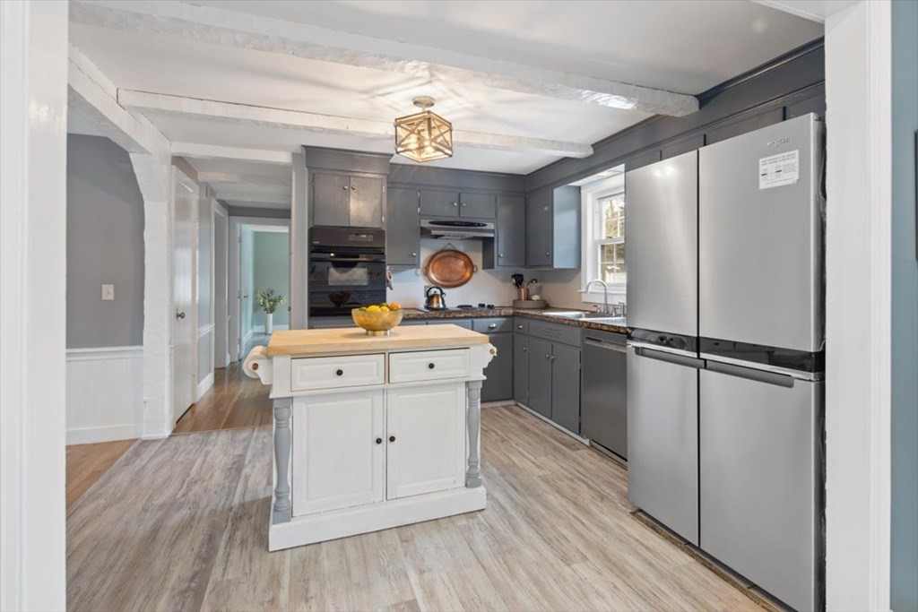 53 Winter Street Kingston, MA 02364 - Photo 14 of 28 a kitchen with a refrigerator sink and cabinets