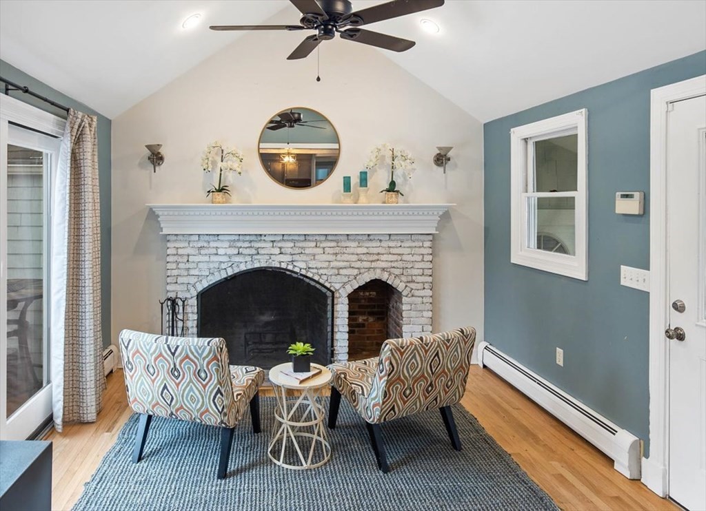 53 Winter Street Kingston, MA 02364 - Photo 15 of 28 a living room with furniture and a fireplace