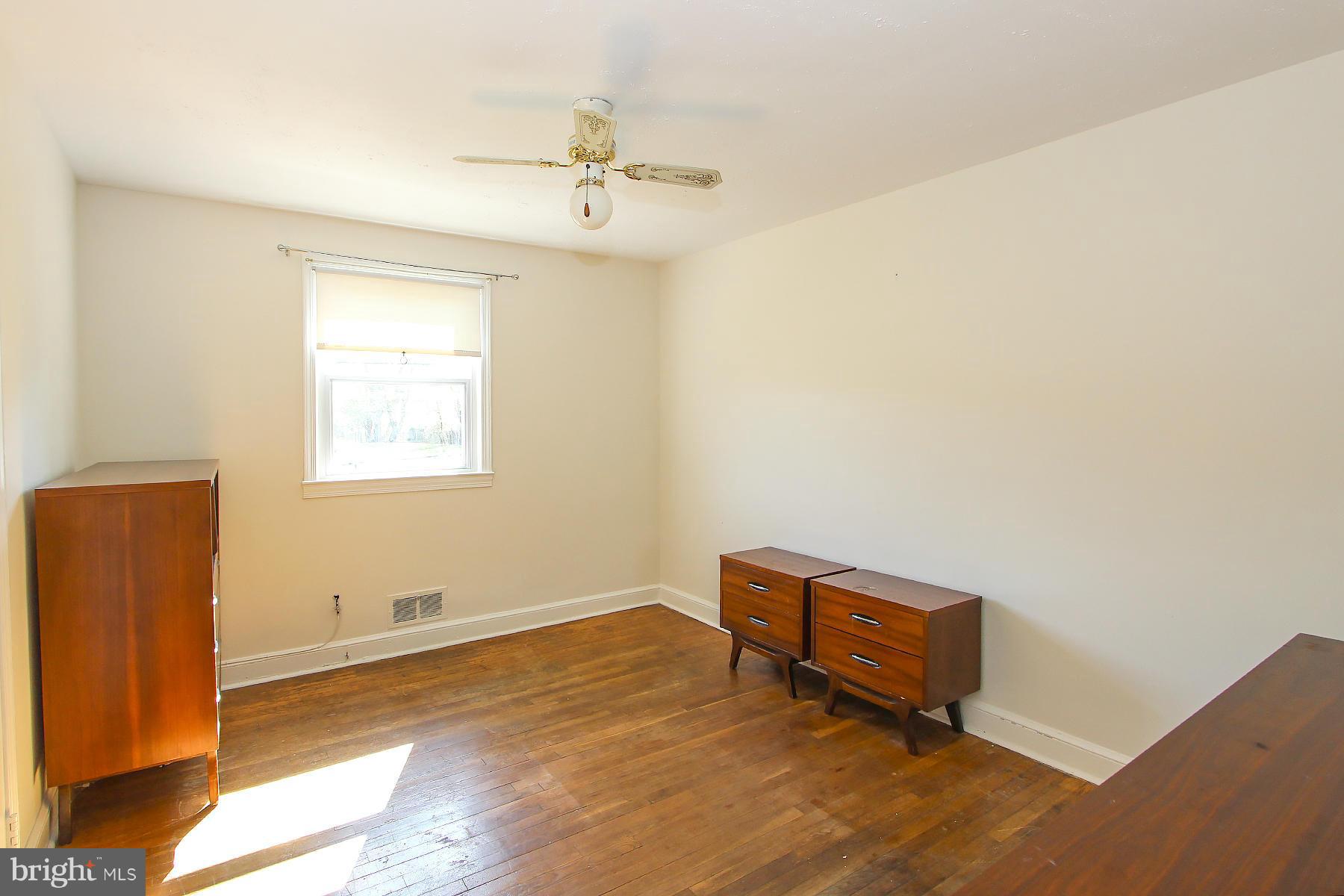 20820 Slidell Road Boyds, MD 20841 - Photo 13 of 29 a room with a window and a chair