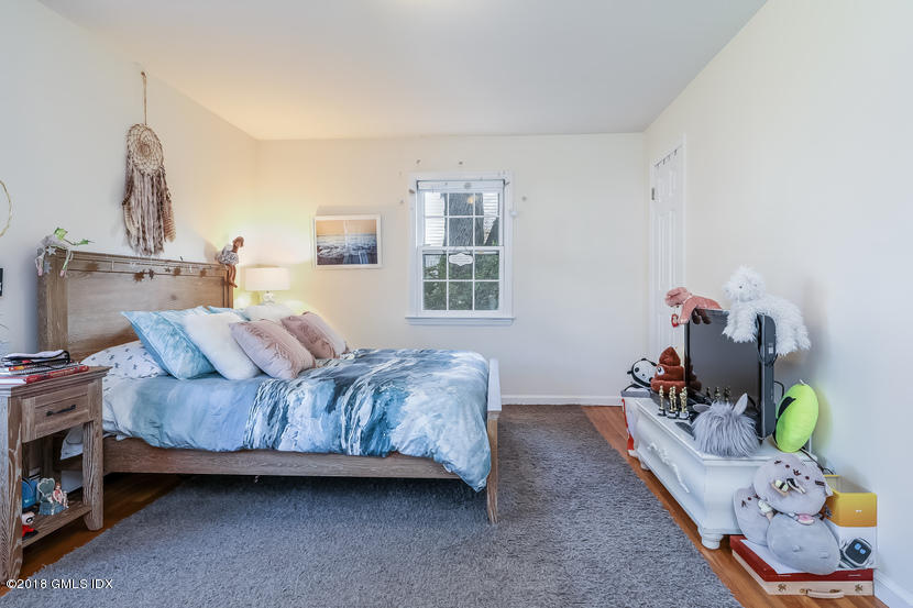 105 Lockwood Road Riverside, CT 06878 - Photo 13 of 22 a bedroom with bed and a window