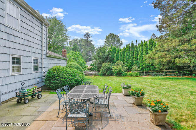 105 Lockwood Road Riverside, CT 06878 - Photo 20 of 22 a view of a backyard with sitting area and garden