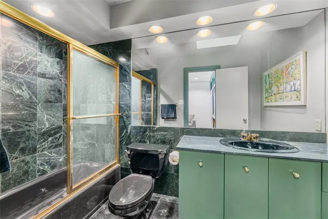 a living room with fireplace furniture and a flat screen tv