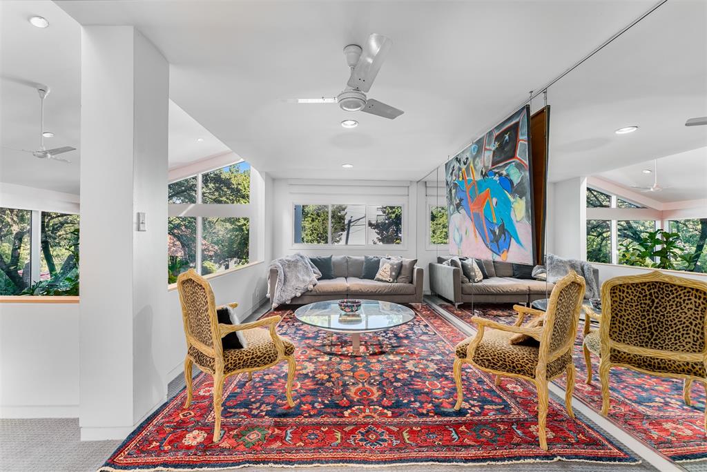 10406 Crestover Drive Dallas, TX 75229 - Photo 15 of 30 a living room with fireplace furniture and a flat screen tv