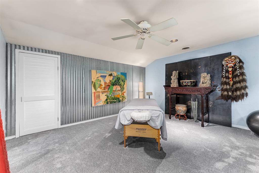 10406 Crestover Drive Dallas, TX 75229 - Photo 16 of 30 a living room with furniture and a flat screen tv